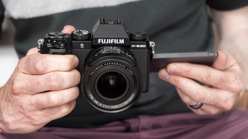 Fujifilm X-S20 camera in hand