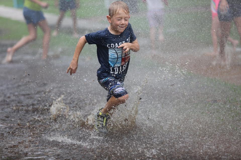 The Fort Myers Fire Department cooled kids off at an end-of-the-school-year party at Jefferson Park in Fort Myers on Thursday, June 17, 2021.