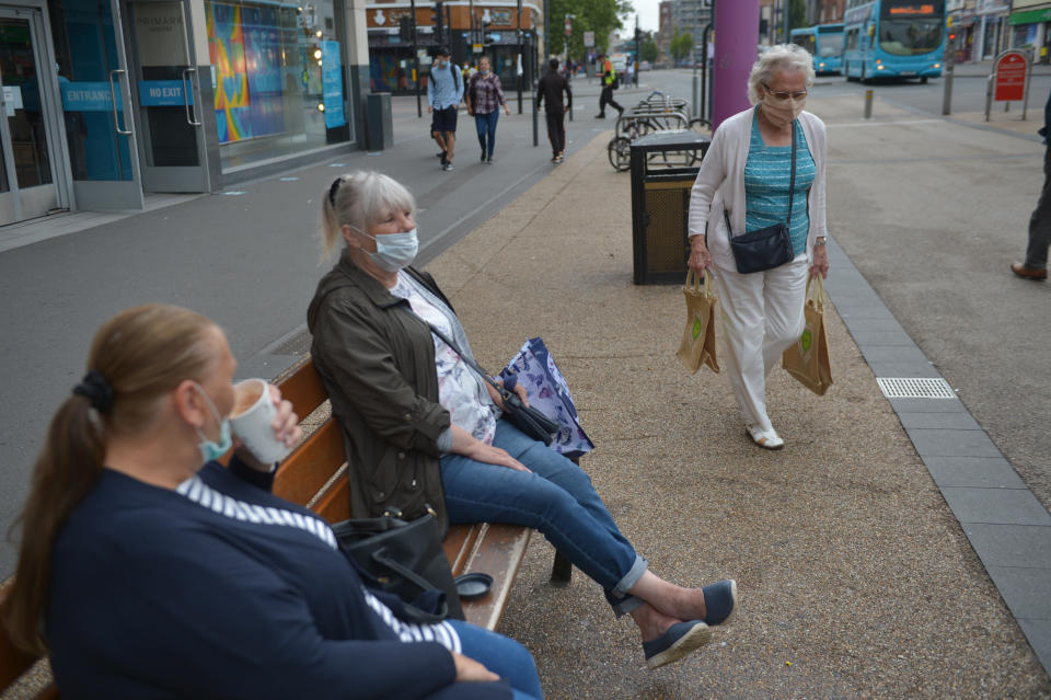 People wearing masks in Leicester city centre as face coverings become mandatory in shops and supermarkets in England. (Photo by Jacob King/PA Images via Getty Images)