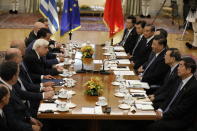 Heading their respective delegations, China's President Xi Jinping, 3rd right, and his Greek counterpart Prokopis Pavlopoulos, 5th left, hold their meeting at the Presidential palace in Athens, Monday, Nov. 11, 2019. Xi Jinping is in Greece on a two-day official visit. (AP Photos/Petros Giannakouris)