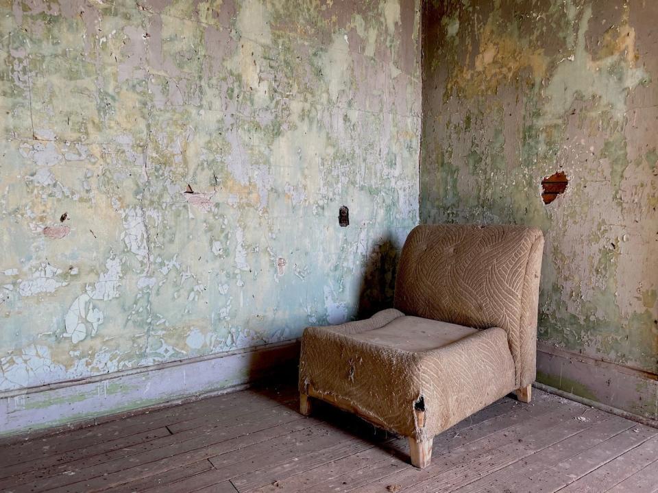 An old chair inside OT Jackson's former home in Dearfield, Colorado.