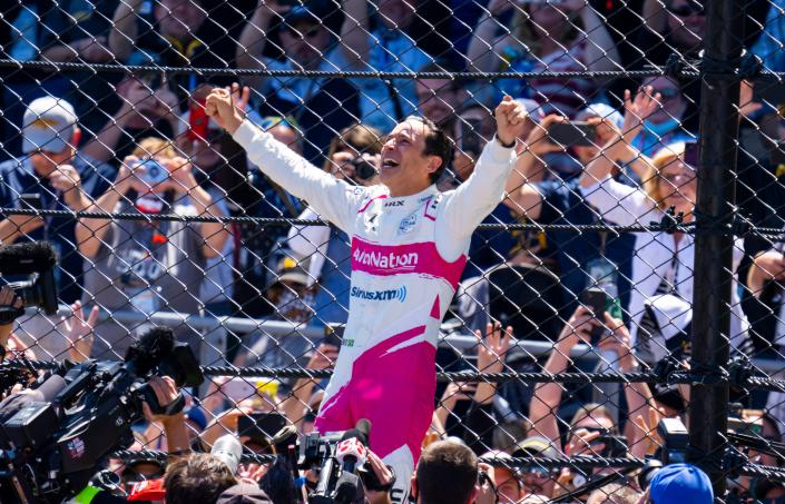 Helio Castroneves leads a raucous celebration after winning the 105th Indianapolis 500 last may to join A.J. Foyt, Al Unser and Rick Mears in the club of four-time winners.