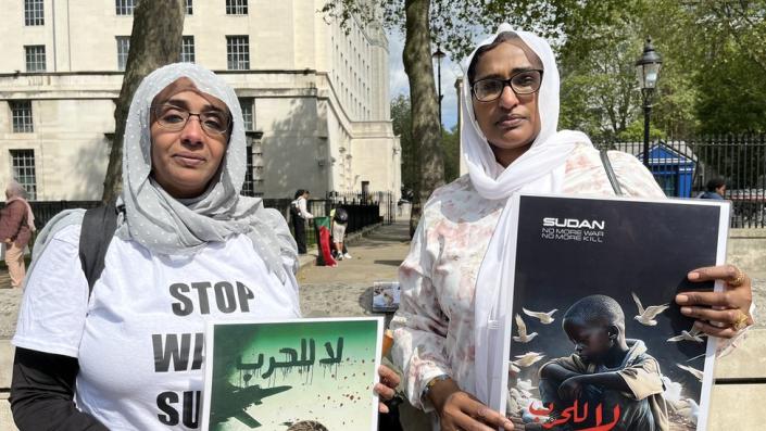 Two protesters against Sudan.