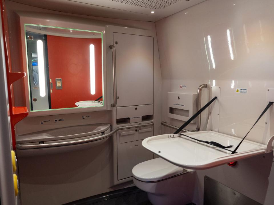 The bathroom inside the new Amtrak Acela with a diaper changing table.