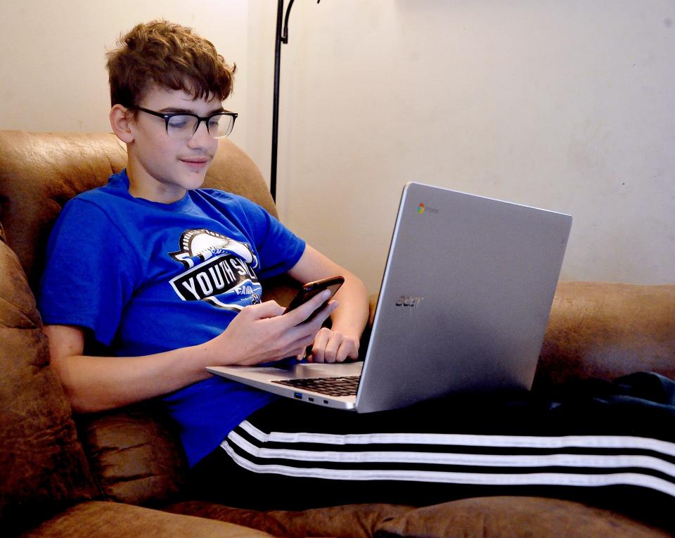 Andrew Yeager spends time studying words and definitions on his laptop as he prepares for his trip to the Scripps National Spelling Bee later this month outside Washington, D.C.