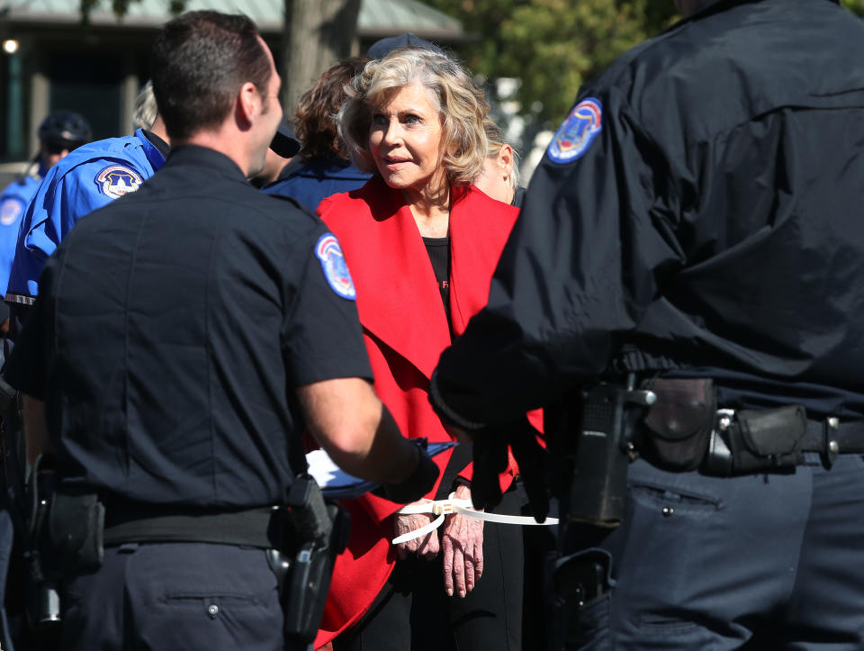 WASHINGTON, DC - OCTOBER 18: Actress Jane Fonda is arrested for blocking a street in front of the U.S. Capitol during a “Fire Drill Fridays” climate change protest and rally on Capitol Hill, October 18, 2019 in Washington, DC. Protesters are demanding urgent action on adapting the Green New Deal, clean, renewable energy, and an end to all new fossil fuel exploration and drilling.   (Photo by Mark Wilson/Getty Images)