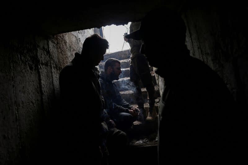 FILE PHOTO: A Ukrainian tank unit crew takes cover in a bunker in Bakhmut