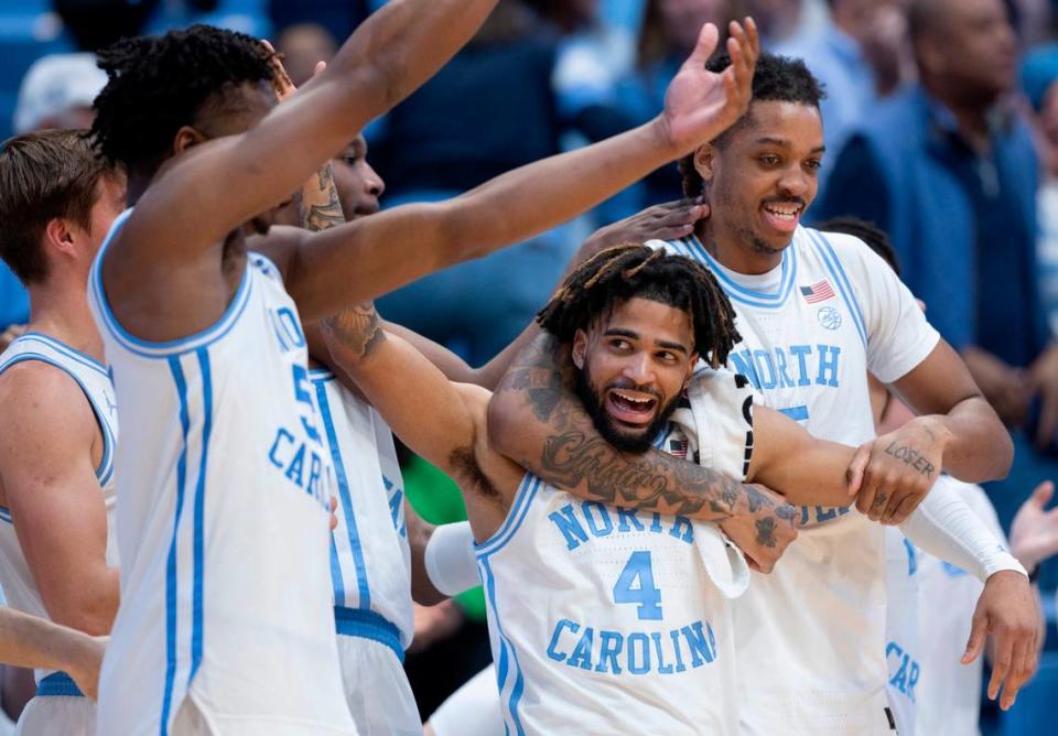 North Carolina’s Armando Bacot (5) embraces R.J. Davis (4) as they celebrate their 103-67 victory over Syracuse on Saturday, January 13, 204 at the Smith Center in Chapel Hill, N.C. Robert Willett/rwillett@newsobserver.com