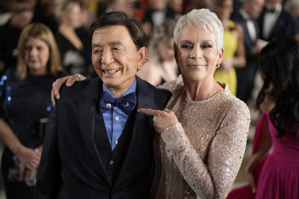 James Hong, left, and Jamie Lee Curtis arrive at the Oscars on Sunday, March 12, 2023, at the Dolby Theatre in Los Angeles. (AP Photo/John Locher)