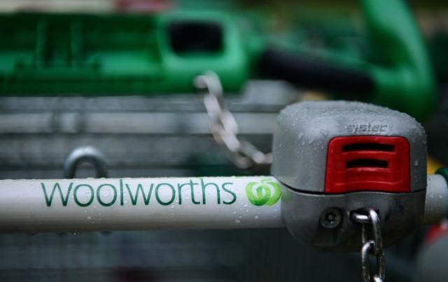 Stock image of a handle of a Woolworths trolley showing the supermarket's logo. Source: AAP