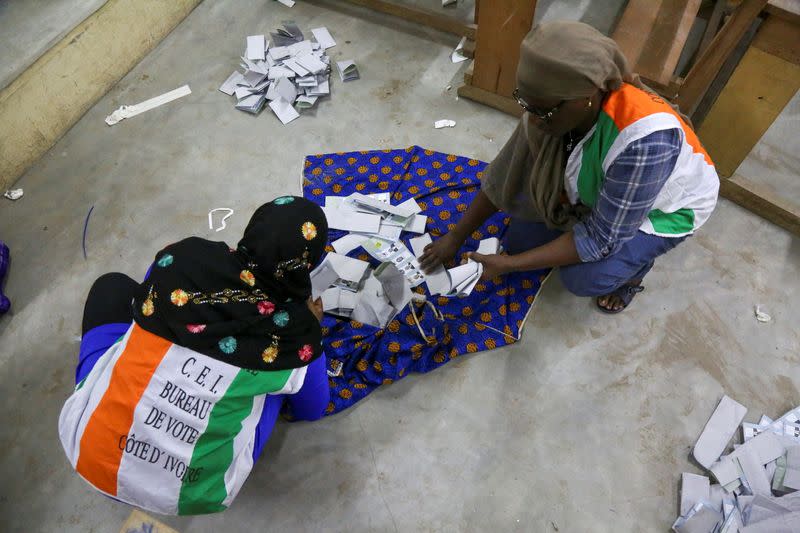 Election officials start to count the ballots during the presidential election in Abidjan