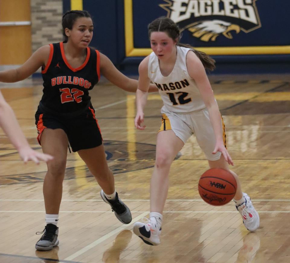 Summerfield’s Destanee Smith guards Audrey Trainor of Erie Mason during a 58-31 Summerfield win Friday night.