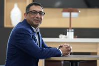 Vimal Patel president of Q Hotels, poses for a photograph at his Holiday Inn Express Hotel in LaPlace, La., Wednesday, June 23, 2021. (AP Photo/Gerald Herbert)