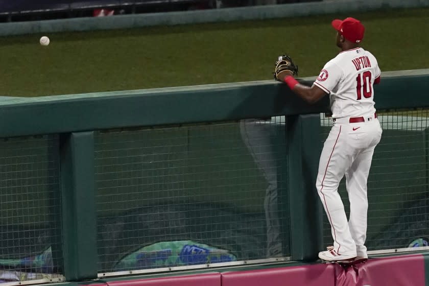 Los Angeles Angels left fielder Justin Upton (10) watches as a home run ball hit by Oakland Athletics.