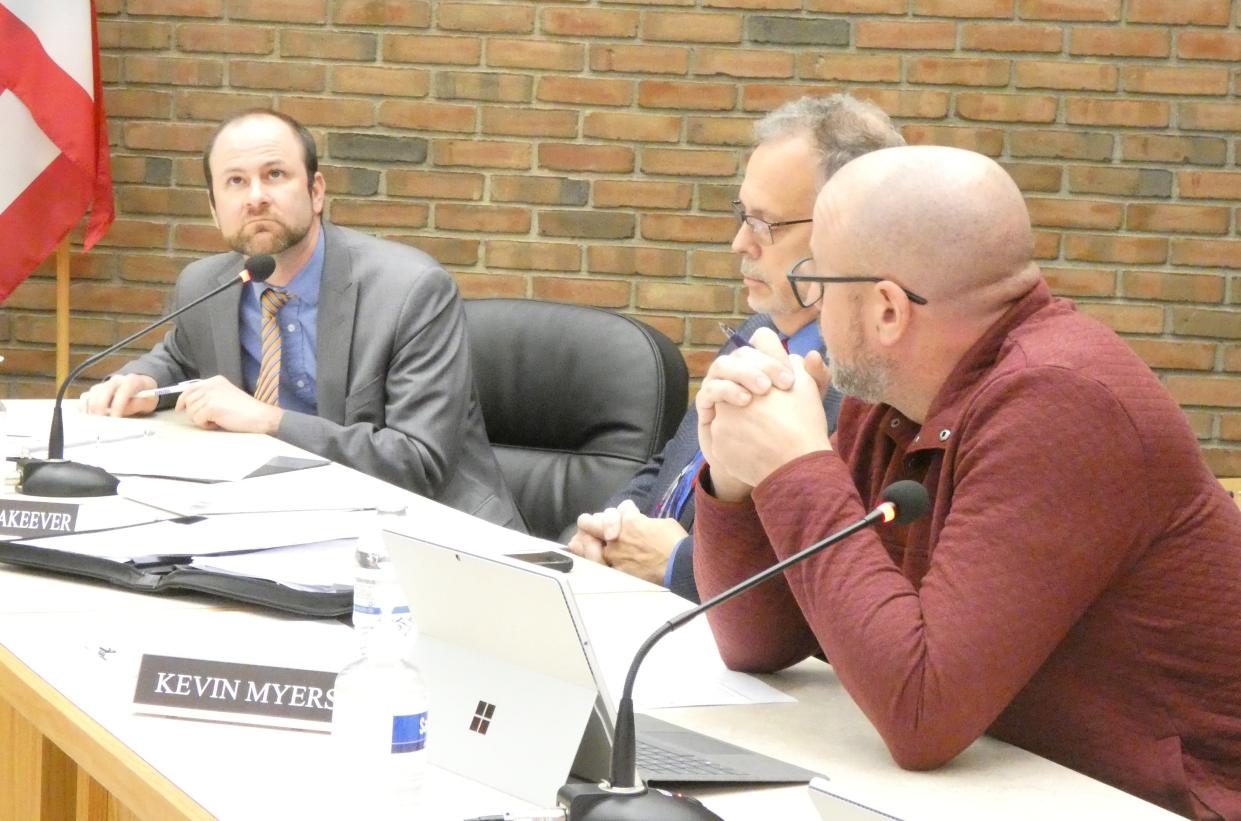 "I'm not so sure it will take effect immediately," Brian Gernert, left, the interim law director, said after Bucyrus City Council overrode the mayor's veto on Tuesday. "I think that it's more complex than simply having council pass that." Council members Matt Makeever, center, and Kevin Myers, right, listen.