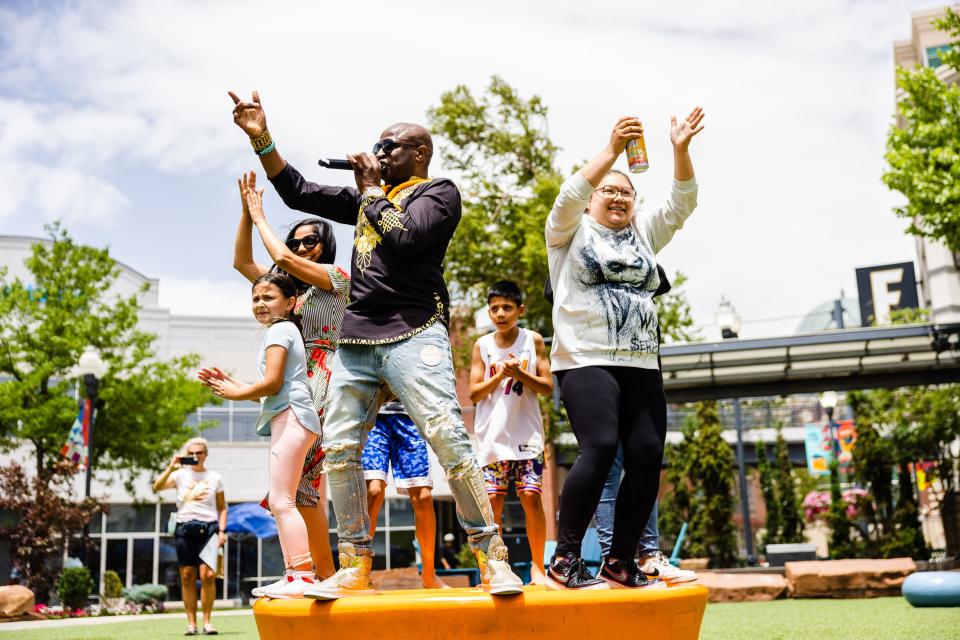 Alex Boye performs with oonlookers during the Juneteenth celebration at The Gateway in Salt Lake City on June 19, 2023. | Ryan Sun, Deseret News