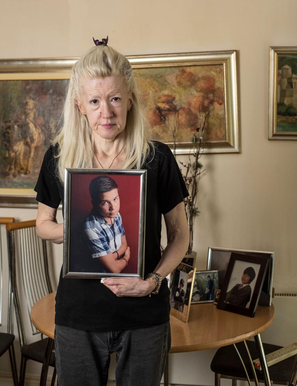 Jasna Badzak holds a picture of her son, Sven, 22, who was stabbed to death as he returned from a shopping trip to Waitrose in Kilburn (Daniel Hambury/Stella Pictures Ltd)