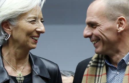 International Monetary Fund (IMF) Managing Director Christine Lagarde (L) poses with Greek Finance Minister Yanis Varoufakis during an extraordinary euro zone finance ministers meeting to discuss Athens' plans to reverse austerity measures agreed as part of its bailout, in Brussels February 11, 2015. REUTERS/Francois Lenoir