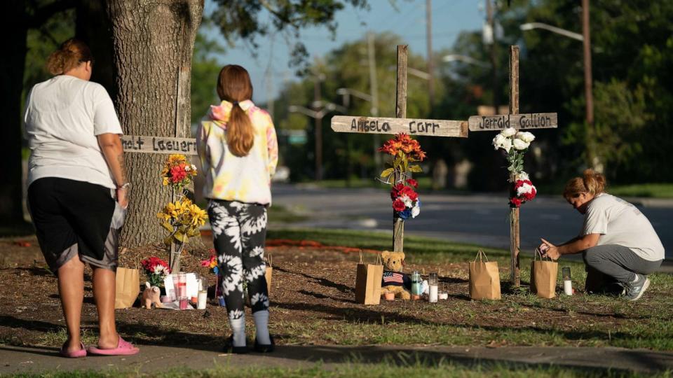 PHOTO: People visit memorials for Jerrald Gallion, Angela Carr and Anolt Joseph Laguerre Jr. near a Dollar General store, August 28, 2023 in Jacksonville, Florida. (Sean Rayford/Getty Images)