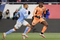 New York City FC defender Alexander Callens, left, celebrates with goalkeeper Sean Johnson after the team's 3-2 win over the New England Revolution, following penalty kicks, in an MLS playoff soccer match Tuesday, Nov. 30, 2021, in Foxborough, Mass. (AP Photo/Charles Krupa)