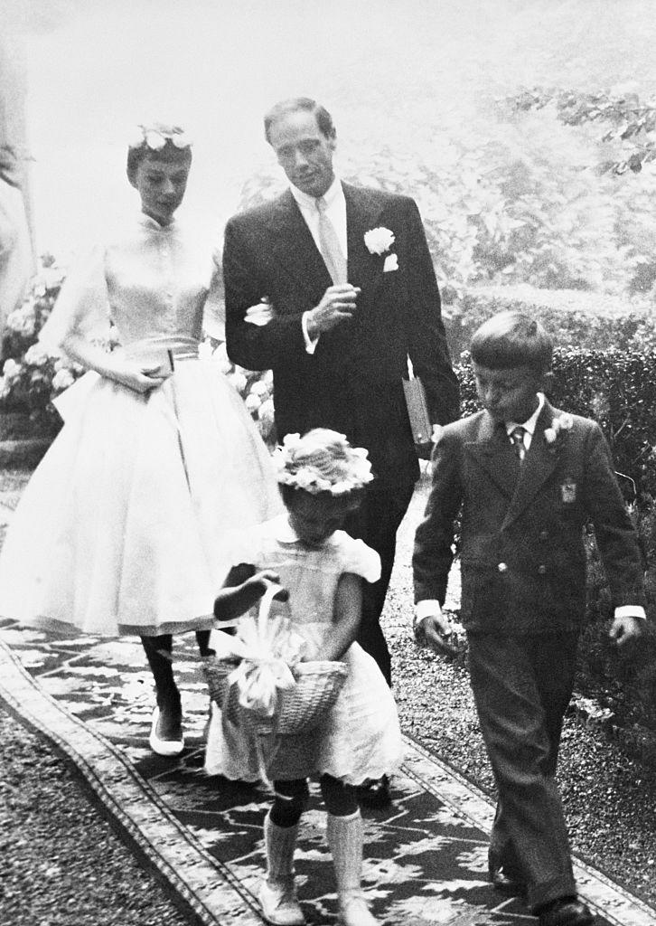 <p>Following a young flower girl and page boy, Audrey Hepburn and Mel Ferrer are photographed during their small wedding ceremony in Burgenstock, Switzerland in 1954. <br></p>