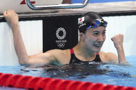 Yui Ohashi of Japan celebrates winning the women's 200-meter individual medley final at the 2020 Summer Olympics, Wednesday, July 28, 2021, in Tokyo, Japan. (AP Photo/Matthias Schrader)