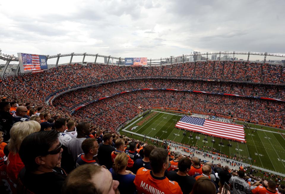 The national anthem, played here Sunday in Denver, at NFL games is part of the debate in NFL TV ratings. (AP) 