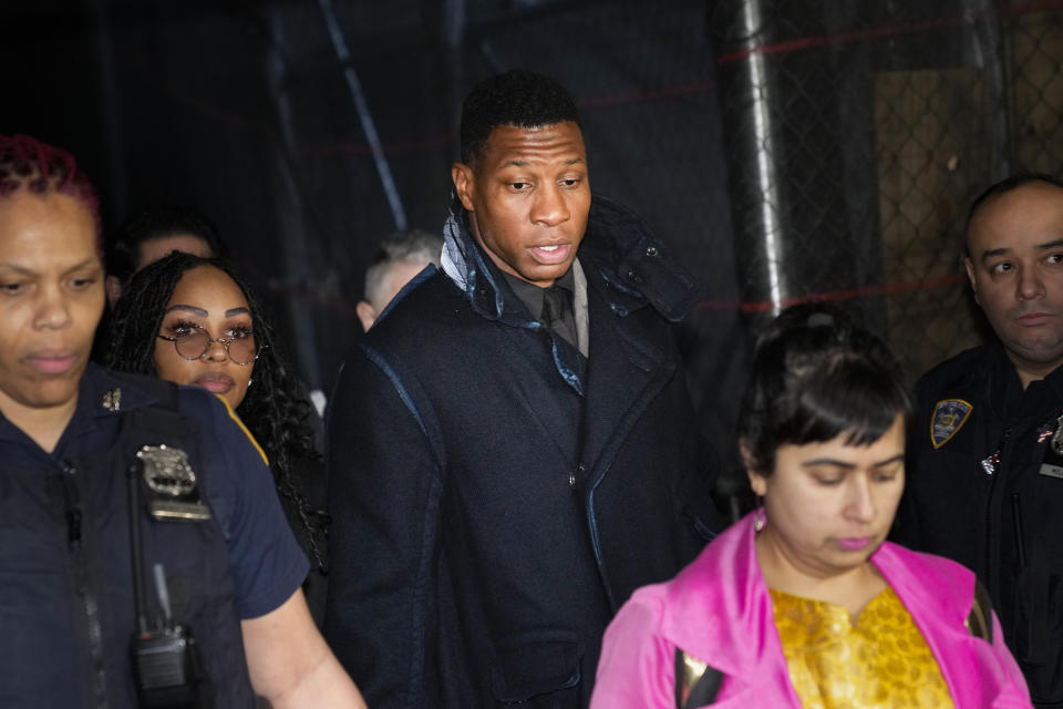 Jonathan Majors, third from left, leaves a courtroom in New York, Monday, Dec. 18, 2023. Majors was convicted of assaulting his former girlfriend during a confrontation in New York City earlier this year. A Manhattan jury convicted the Marvel star Monday of one misdemeanor assault charge and one harassment violation. (AP Photo/Seth Wenig)