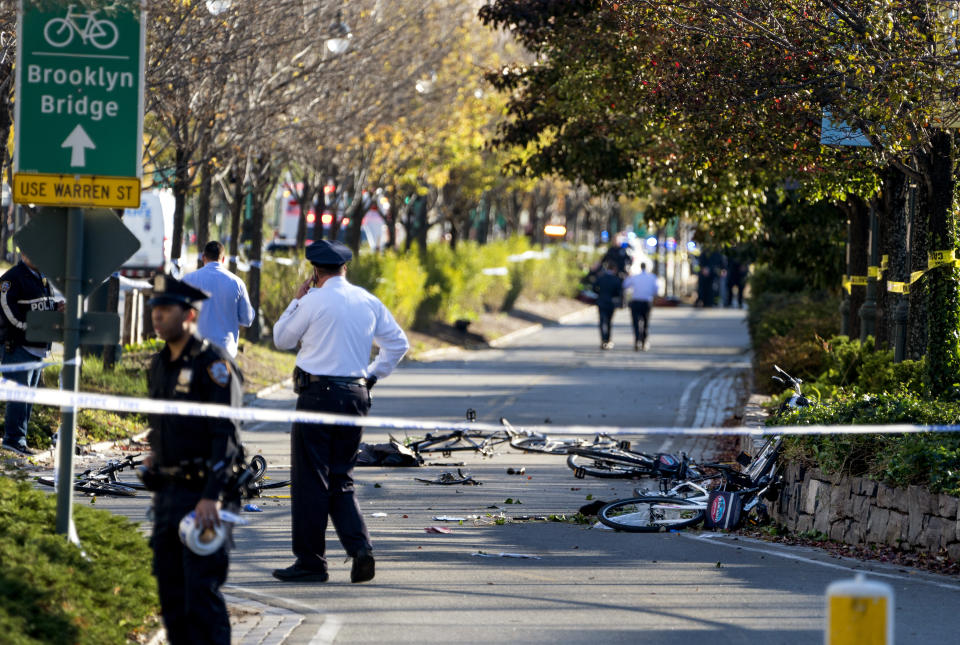 <p>Bicycles and debris lay on a bike path after a motorist drove onto the path near the World Trade Center memorial, striking and killing several people on Oct. 31, 2017. (Photo: Craig Ruttle/AP) </p>