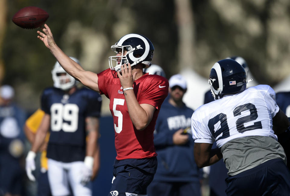 FILE - In this July 29, 2019, file photo, Los Angeles Rams quarterback Blake Bortles throws a pass during the NFL football team's training camp in Irvine, Calif. Bortles gets his first opportunity to show if an offseason with coach Sean McVay has led to improvement. Bortles signed with Los Angeles following his first five seasons in Jacksonville. (AP Photo/Kelvin Kuo, File)