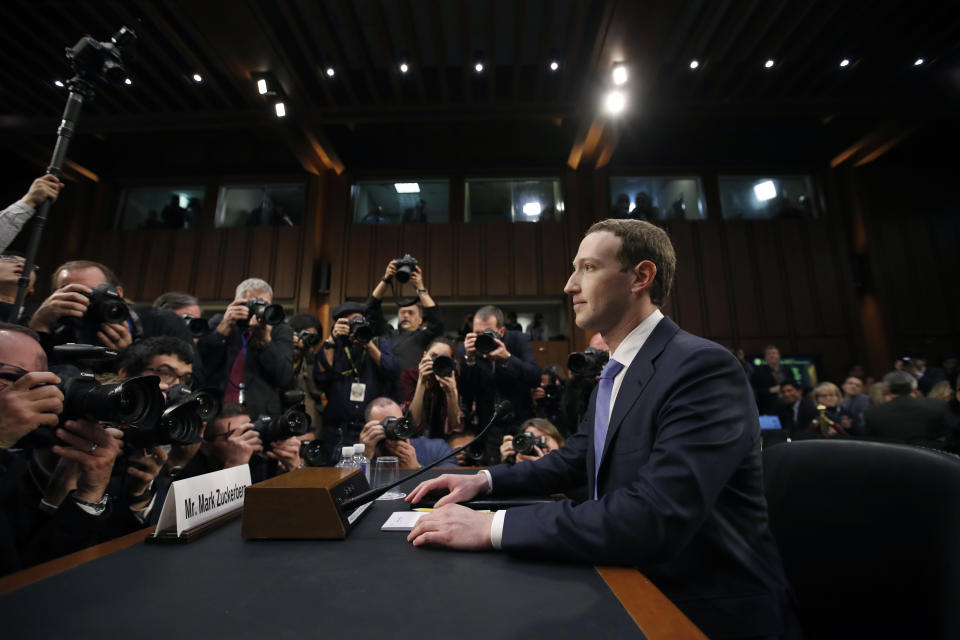FILE - Facebook CEO Mark Zuckerberg takes his seat to testify before a joint hearing of the Commerce and Judiciary Committees on Capitol Hill in Washington, April 10, 2018, about the use of Facebook data to target American voters in the 2016 election. Zuckerberg, who was back in damage control mode on Wednesday, Jan. 31, 2024, when he apologized to the parents of children exploited, bullied or driven to self harm via social media, has accumulated a long history of public apologies, often issued in the wake of crisis or when Facebook users rose up against unannounced changes in its service. (AP Photo/Alex Brandon, File)