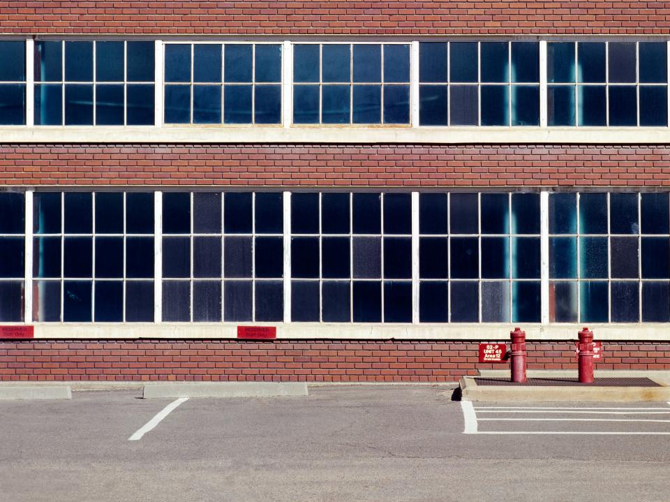 parking spots against school building