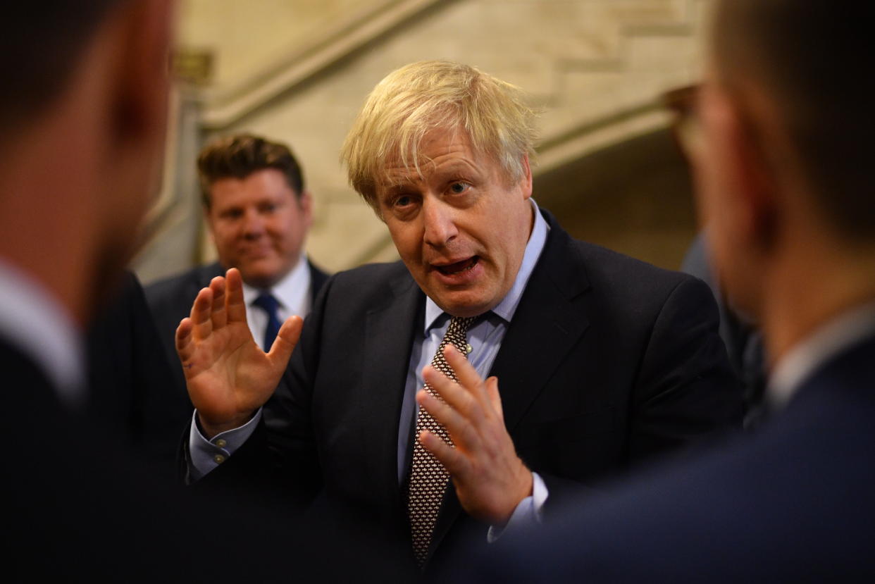 LONDON, ENGLAND - DECEMBER 16: UK Prime Minister Boris Johnson talks with newly-elected Conservative MPs at the Houses of Parliament on December 16, 2019 in London, England. Boris Johnson called a General Election to break the parliamentary deadlock over Brexit and was rewarded with a clear majority of 80. He welcomes 109 new Conservative MPs to Parliament. They will be sworn in as MPs on Tuesday 17th December.  (Photo by Leon Neal/Getty Images)