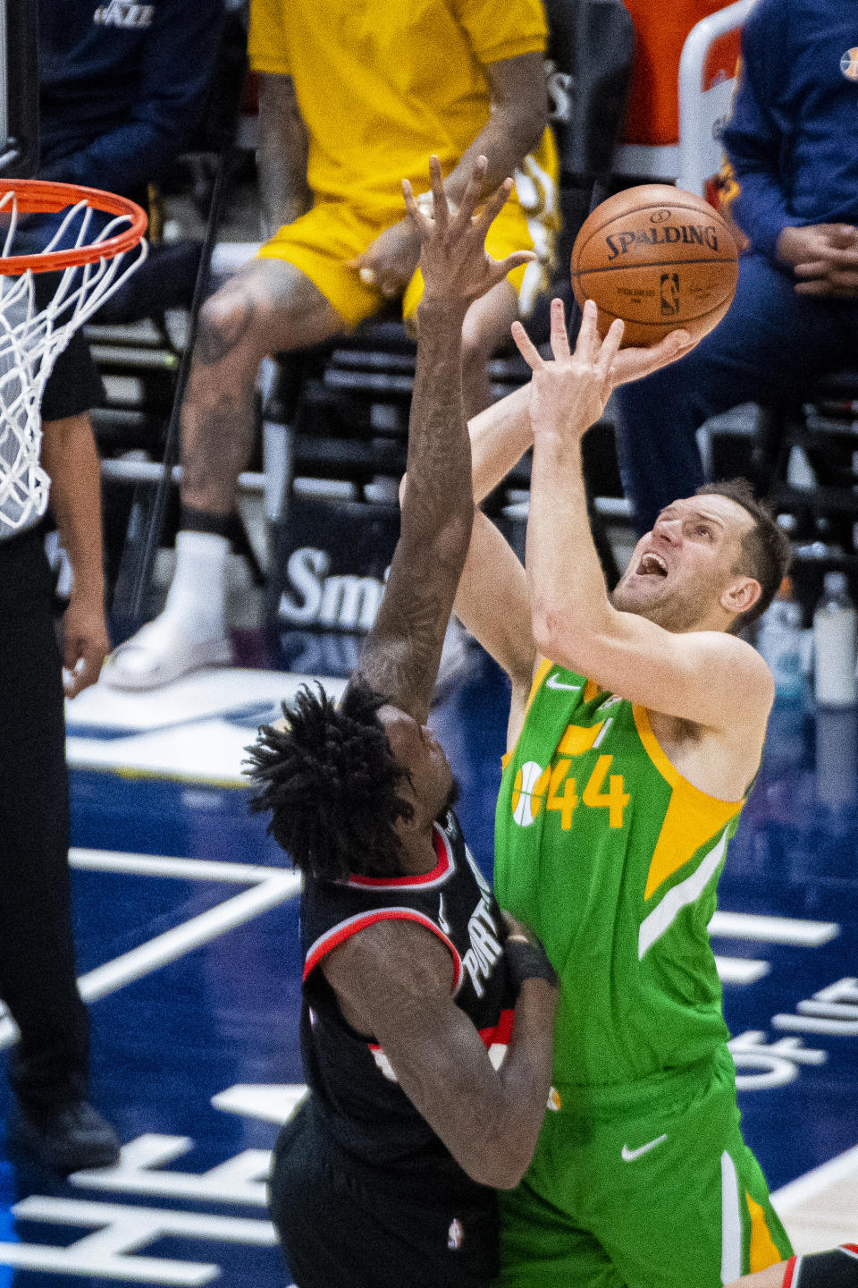 Utah Jazz forward Bojan Bogdanovic (44) shoots as Portland Trail Blazers forward Nassir Little defends during the first half of an NBA basketball game Thursday, April 8, 2021, in Salt Lake City. (AP Photo/Isaac Hale)