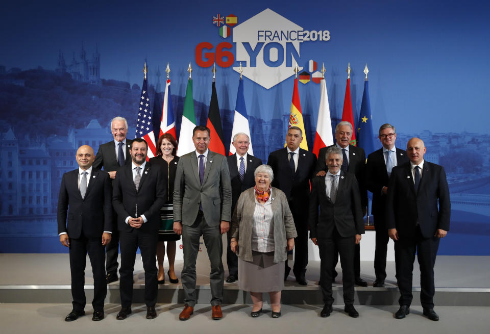 From left, British Home Secretary Sajid Javid, Jean-Marc Chataigner, Ambassador and French Special Envoy for Sahel, Italian Interior Minister Matteo Salvini, US Secretary Homeland Security Kirstjen Nielsen, German Ministry of the Interior Stephan Mayer, US Attorney General Jeff Sessions, French Minister attached to the Interior Minister Jacqueline Gourault, Moroccoan Interior Minister Abdelouafi Laftit, Spanish Interior Minister Fernando Grande-Marlaska, European Union Commissioner for Migration, Home Affairs and Citizenship Dimitris Avramopoulos, European Commissioner for the Security Union Julian King, Polish Interior Minister Joachim Brudzinski, attend a family picture at the G6 Interior Ministers' meeting in Decines, near Lyon, central France, Tuesday, Oct. 9, 2018. (AP Photo/Christophe Ena)