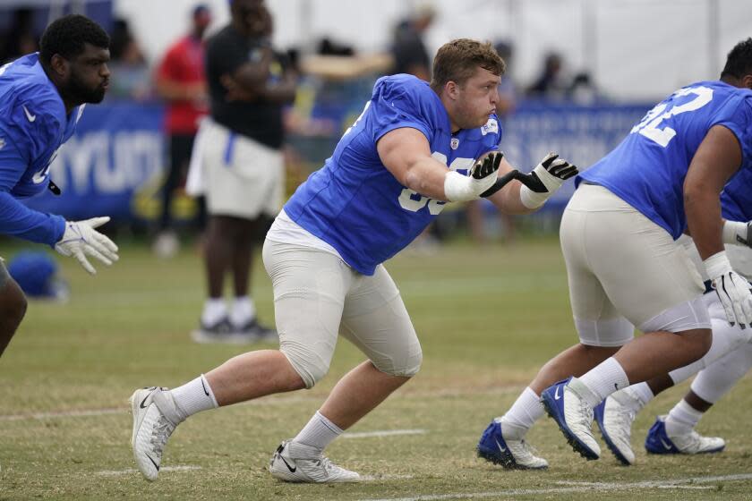 Rams offensive guard Logan Bruss (60) participates in drills.