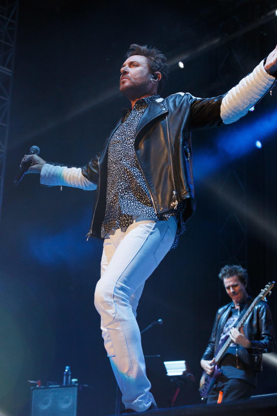 Duran Duran bassist John Taylor (background) and singer Simon Le Bon performing live. The band hopes to plan a U.S. tour for 2022.