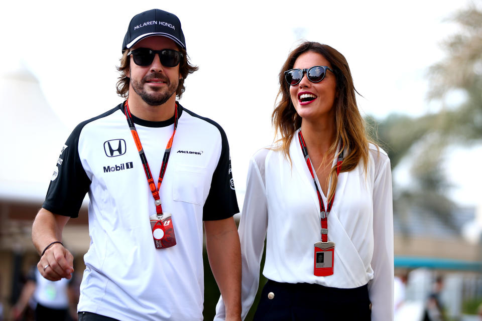 ABU DHABI, UNITED ARAB EMIRATES - NOVEMBER 28:  Fernando Alonso of Spain and McLaren Honda walks in the paddock with his girlfriend Lara Alvarez before final practice for the Abu Dhabi Formula One Grand Prix at Yas Marina Circuit on November 28, 2015 in Abu Dhabi, United Arab Emirates.  (Photo by Mark Thompson/Getty Images)