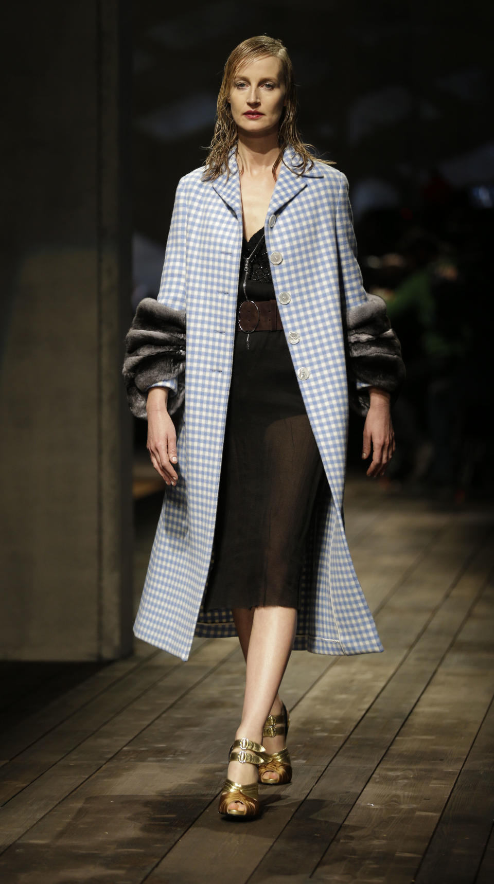 A model wears a creation for Prada women's Fall-Winter 2013-14 collection, part of the Milan Fashion Week, unveiled in Milan, Italy, Thursday, Feb. 21, 2013. (AP Photo/Luca Bruno)