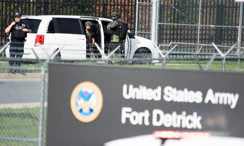 Members of the Frederick Police Department Special Response Team prepare to enter Fort Detrick following a shooting in the Riverside Tech Park on Tuesday.