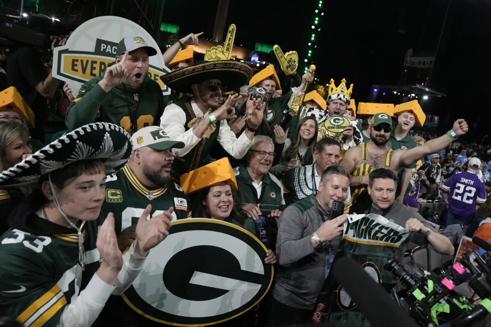 Green Bay Packers cheer during the first round of the NFL football draft, Thursday, April 27, 2023, in Kansas City, Mo. (AP Photo/Charlie Riedel)