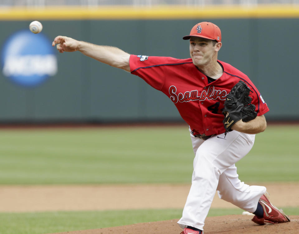 Stony Brook's starting pitcher Tyler Johnson delivers against UCLA in the first inning of an NCAA College World Series baseball game in Omaha, Neb., Friday, June 15, 2012. (AP Photo/Nati Harnik)