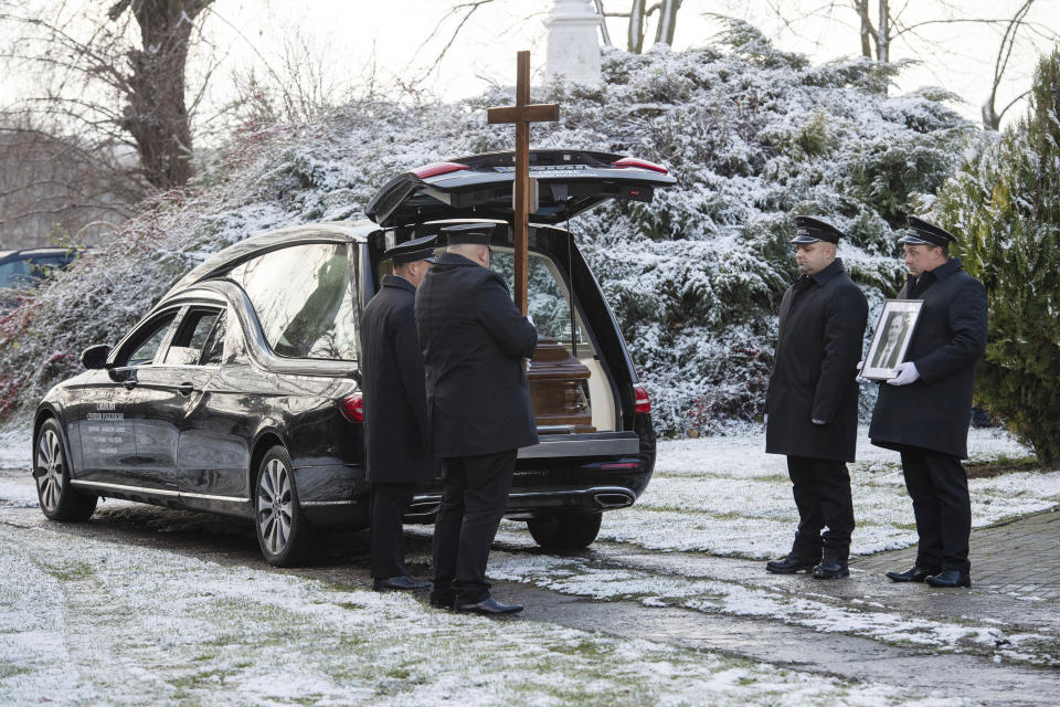 Pallbearers stand by the vehicle carrying the coffin of Boguslaw Wos, one of two Polish men killed in a missile explosion ahead of his funeral, in Przewodow, Poland, Saturday, Nov. 19, 2022. The deaths were likely the result of a Ukrainian air defense missile that went astray as the country was defending itself against a barrage of Russian missiles directed at Ukraine’s power infrastructure. (AP Photo)