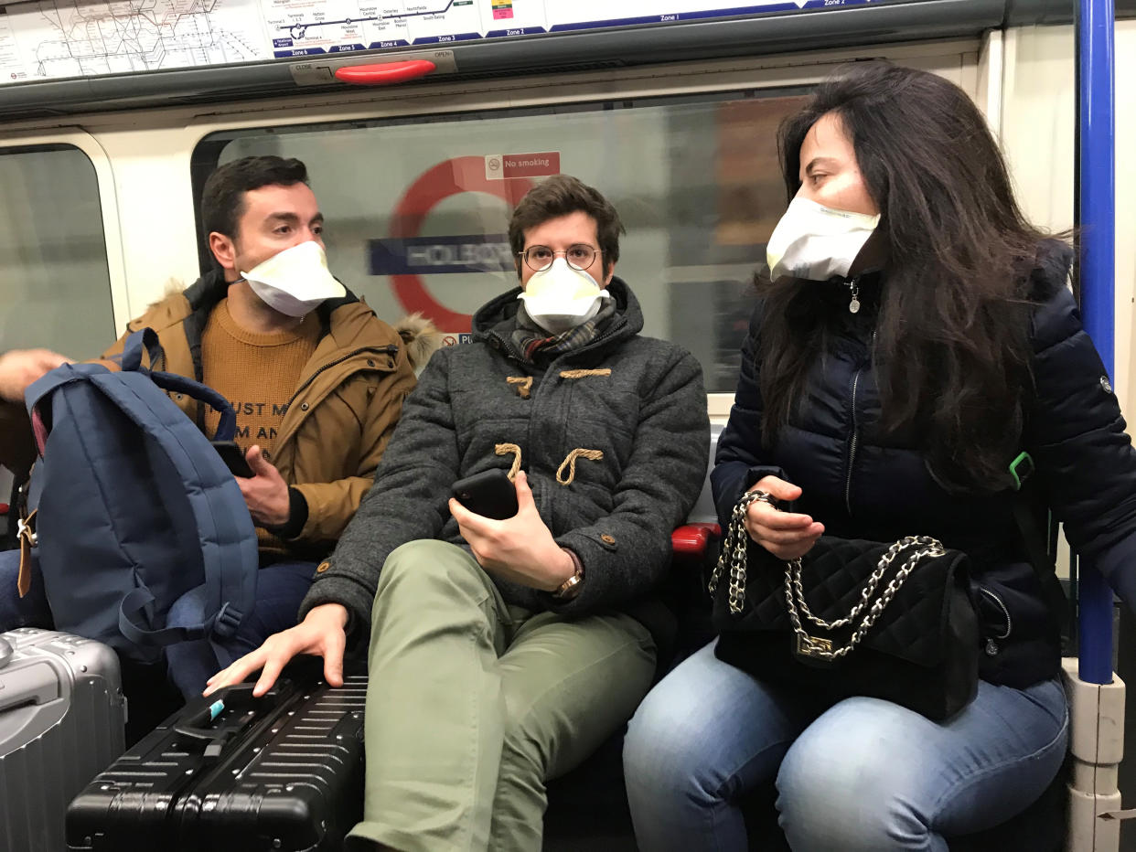 People wearing face masks on the London Underground, as the first case of coronavirus has been confirmed in Wales and two more were identified in England - bringing the total number in the UK to 19. (Photo by Kirsty O'Connor/PA Images via Getty Images)