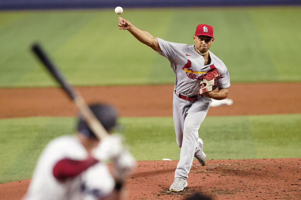 St. Louis Cardinals starting pitcher Jordan Hicks throws during the third inning of a baseball game against the Miami Marlins, Thursday, April 21, 2022, in Miami. (AP Photo/Lynne Sladky)