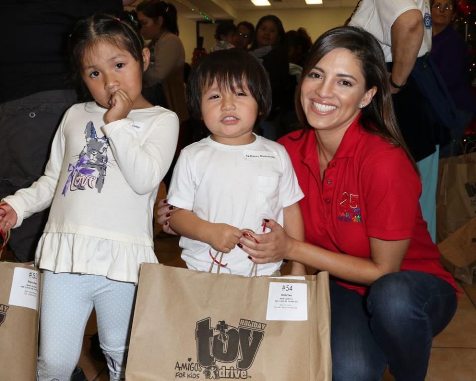 Pamela Silva Conde and children at the Amigos For Kids holiday toy drive in 2017.