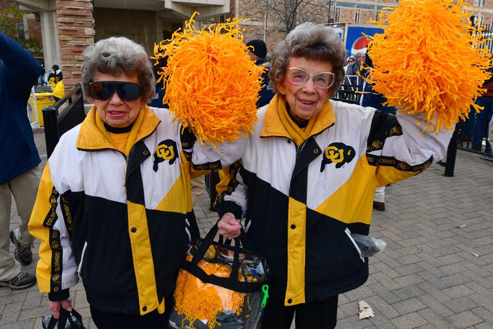 Colorado Buffaloes fans Peggy Coppom and Betty Hoover enter the stadium prior to the game against the Washington State Cougars at Folsom Field.