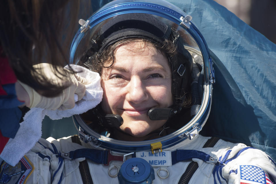 In this handout photo released by Gagarin Cosmonaut Training Centre (GCTC), Roscosmos space agency, U.S. astronaut Jessica Meir gets assistance shortly after the landing of the Russian Soyuz MS-15 space capsule near Kazakh town of Dzhezkazgan, Kazakhstan, Friday, April 17, 2020. An International Space Station crew has landed safely after more than 200 days in space. The Soyuz capsule carrying NASA astronauts Andrew Morgan, Jessica Meir and Russian space agency Roscosmos' Oleg Skripochka touched down on Friday on the steppes of Kazakhstan. (Andrey Shelepin, Gagarin Cosmonaut Training Centre (GCTC), Roscosmos space agency, via AP)