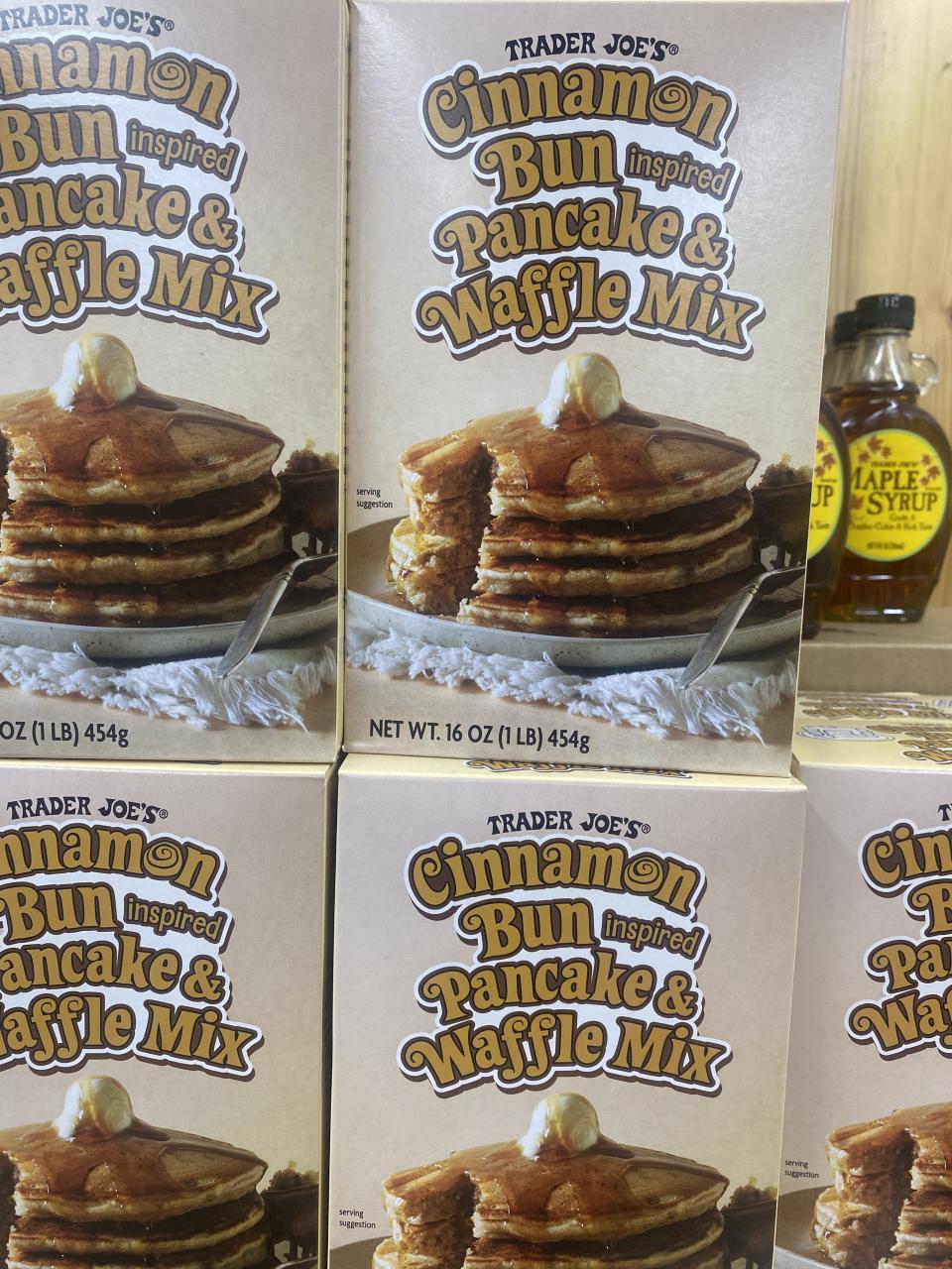 boxes of cinnamon bun pancake and waffle mix stocked on a shelf