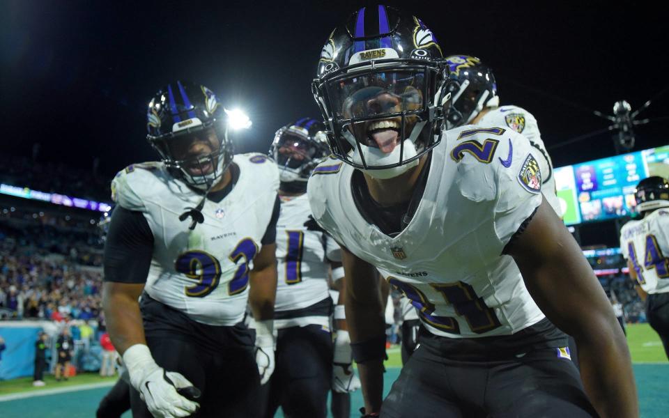 Baltimore Ravens cornerback Brandon Stephens (21) celebrates in the end zone after teammate Baltimore Ravens linebacker Patrick Queen (6) recovered Jacksonville Jaguars quarterback Trevor Lawrence’s (16) early fourth quarter fumble. The Jacksonville Jaguars hosted the Baltimore Ravens at EverBank Stadium in Jacksonville, Florida Sunday Night, December 17, 2023. The Jaguars trailed 10 to 0 at the half and lost 23 to 7. [Bob Self/Florida Times-Union]